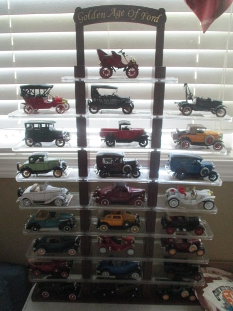 "Golden Age of Ford" 25 Scaled Diecast Cars with Display Stand: Stand 20 1/2" x 3" x 31 1/2", some cars have trading cards, Local Pickup Suggested