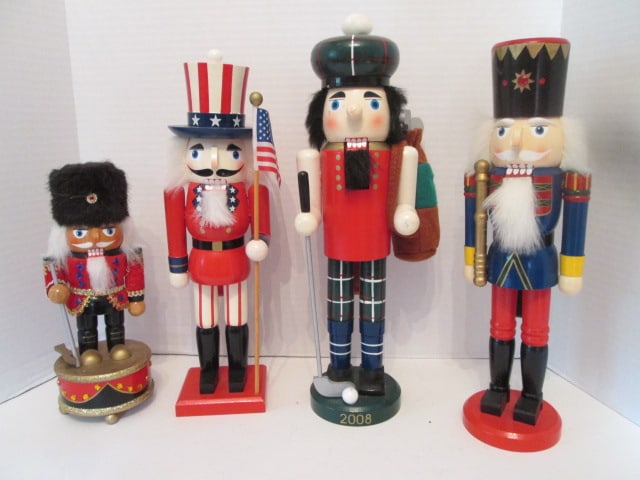 Three Handpainted Nutcrackers and One Musical Nutcracker: Musical Nutcracker 9 1/2"h, Golfer Nutcracker, Uncle Sam Nutcracker, Soldier Nutcracker, tallest 14 1/2"h