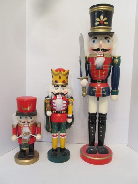 Three Handpainted Nutcrackers: 10 1/4"h, 14 3/4"h, 24 1/4"