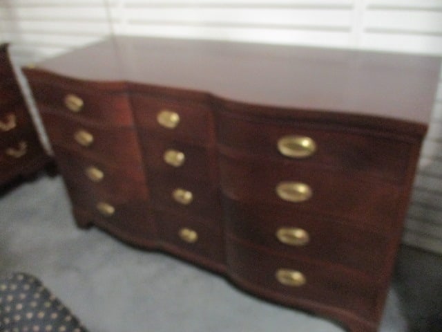 Henredon Genuine Mahogany Serpentine Drawer Front Triple Dresser: 58 1/2" x 23 1/2" x 34 1/4", 12 dovetail drawers with oval brass bail pulls, small veneer chip on right front foot, Local Pickup Only