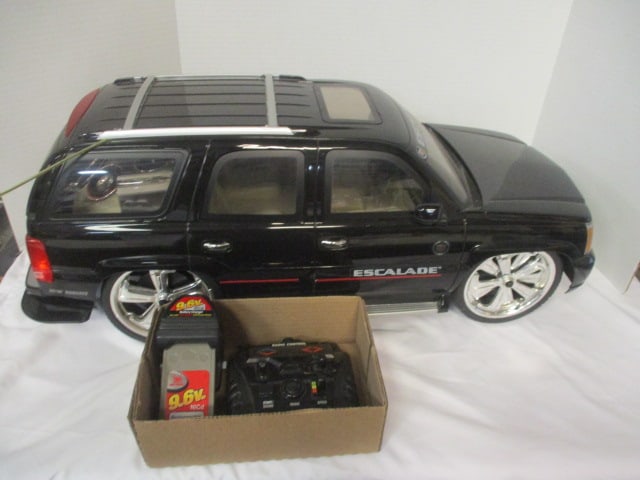 New Bright Cadillac Escalade Radio Controlled Toy Car with Remote,: Battery, and Charger - 1/6 Scale, 27" x 11"