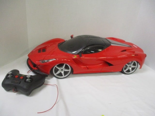 New Bright "Ferrari LaFerrari" Remote Control Toy Car with Remote and: Battery - 1/14 Scale, 21 1/2" x 6", crack, unsure if correct remote