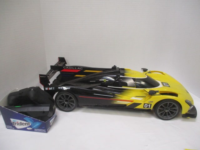 New Bright "Cadillac Racing" Remote Control Toy Car with Remote, Battery,: and Charger - 1/8 Scale, 23" x 6", unsure if correct remote