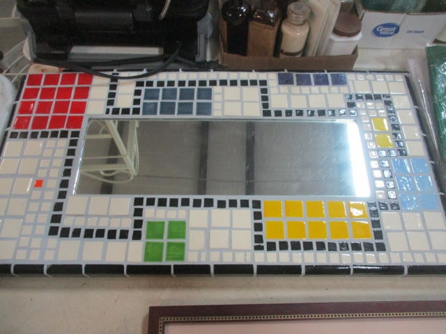 Ceramic Tile Mosaid Mirror: 25 x 13 (1 piece of corner is loose)