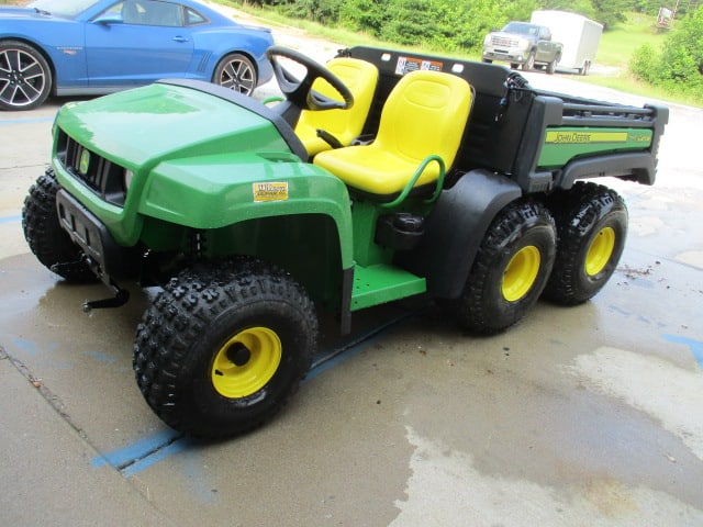 Like New 2013 John Deere Gas 6x4 TH Gator: Only 59.6 hours!! Product Identification #1M06X4HDADM080359, has mounting frame and lift system for snow plow/blade, hydraulic rear dump bed, headlights, DOM 022513, tires still have tits, See Walk Ar
