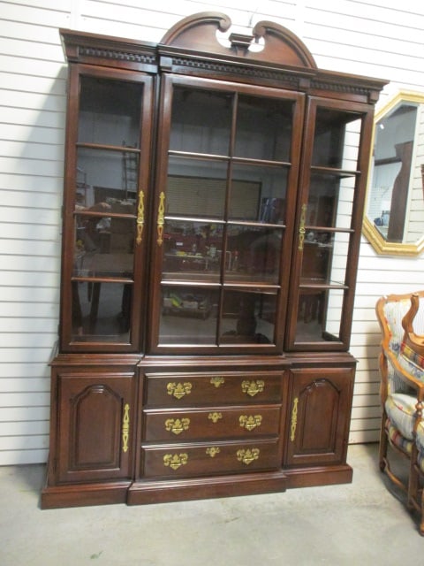 Harden Colonial Revival Mahogany 2 Piece Illuminated Breakfront China Hutch: Base 58 1/2" x 15 1/2" x 25 1/2", China hutch 59" x 16 1/2" x 60", Cabinet is 85 1/2"h overall, Broken scroll pediment with dentil molding, Glass doors and side with wood frame glass insert shelves, H