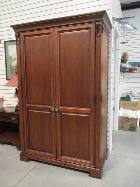 Thomasville Mahogany Raised Panel Computer Armoire with Carved Leaf Accents: 51" x 25 3/4" x 77 1/2", Armoire has pullout keyboard, pullout printer shelf, locking dovetail file drawer with keys, hinge back double doors with raised panel design, power/phone panel, fluorescent