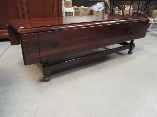 Ethan Allen Early American Style Dark Stained Pine Drop Leaf Coffee Table: 23"(sides down)39"(sides up) s 54" x 17 1/4", some scuffs and scratches, Local Pickup Only