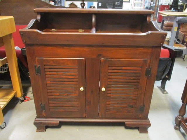 Ethan Allen Early American Style Dark Stained Pine Dry Sink/Goods Cabinet: 38 1/4" x 21" x 39 1/2", cabinet has two louver front doors with porcelain pulls, slanted front apron, left side has lift-top lid, has an adjustable shelf(needs shelf clips), does not have back