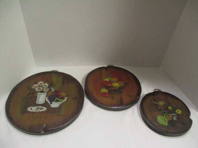 Three 1967 Midcentury Handpainted Wood Trivet Wall Plaques: all dated 1967 and signed V. Kadow, 7 1/2"dia, 9 1/2"dia, 11 1/2"dia