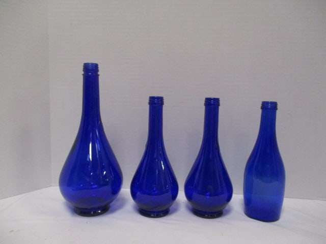 Four Cobalt Blue Glass Bottles: .