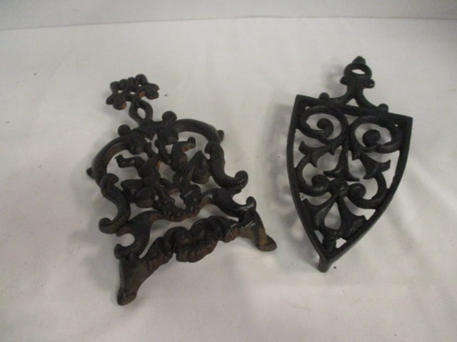 Two Vintage Cast Iron Trivets: .