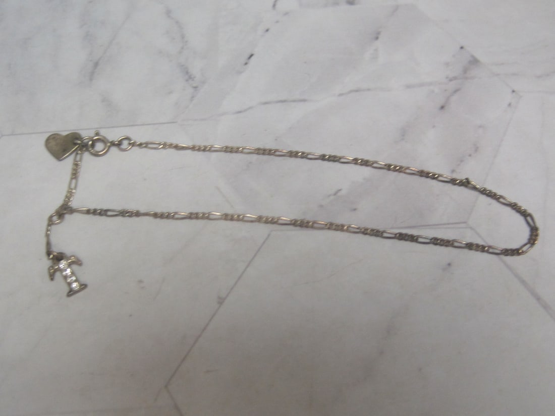 10" Sterling Silver Figaro Bracelet with 2 Charms: Weighs 2.8 grams