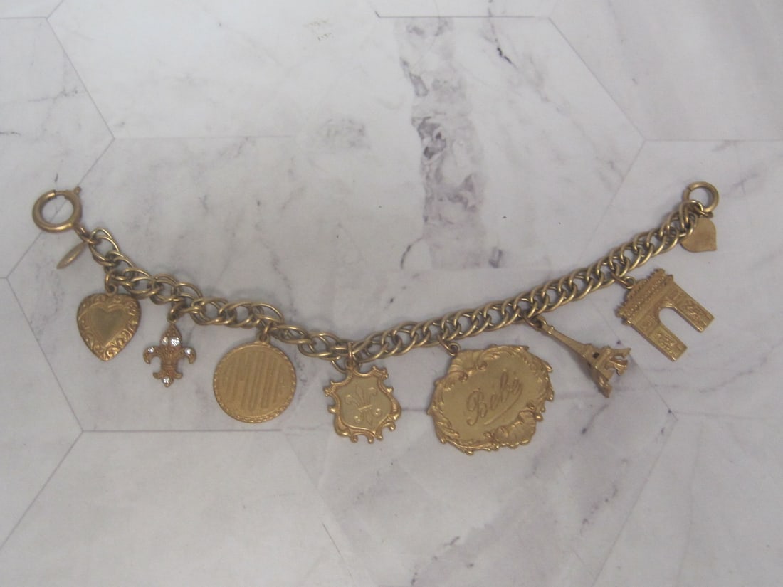 7 1/2" Catherine Popesco France Goldtone Charm Bracelet: .