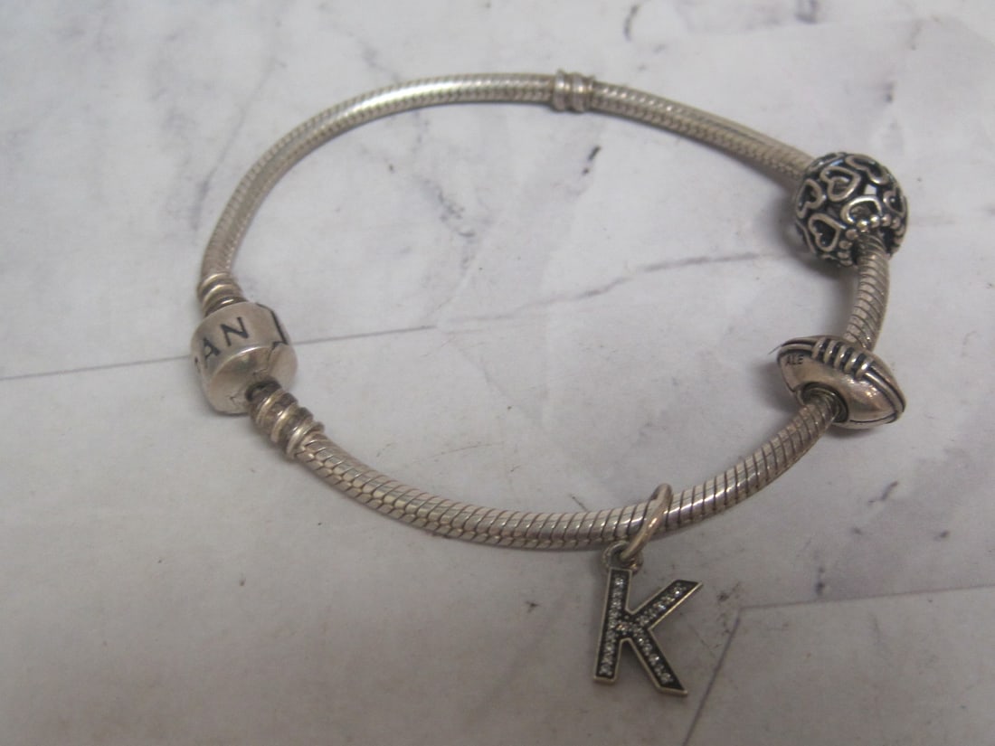 Sterling Silver Pandora Bracelet: Weighs 20.3 grams, Not authenticated