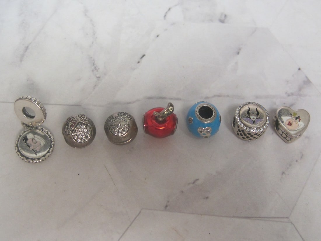 Lot of 7 Pandora Sterling Silver Disney Charms: .
