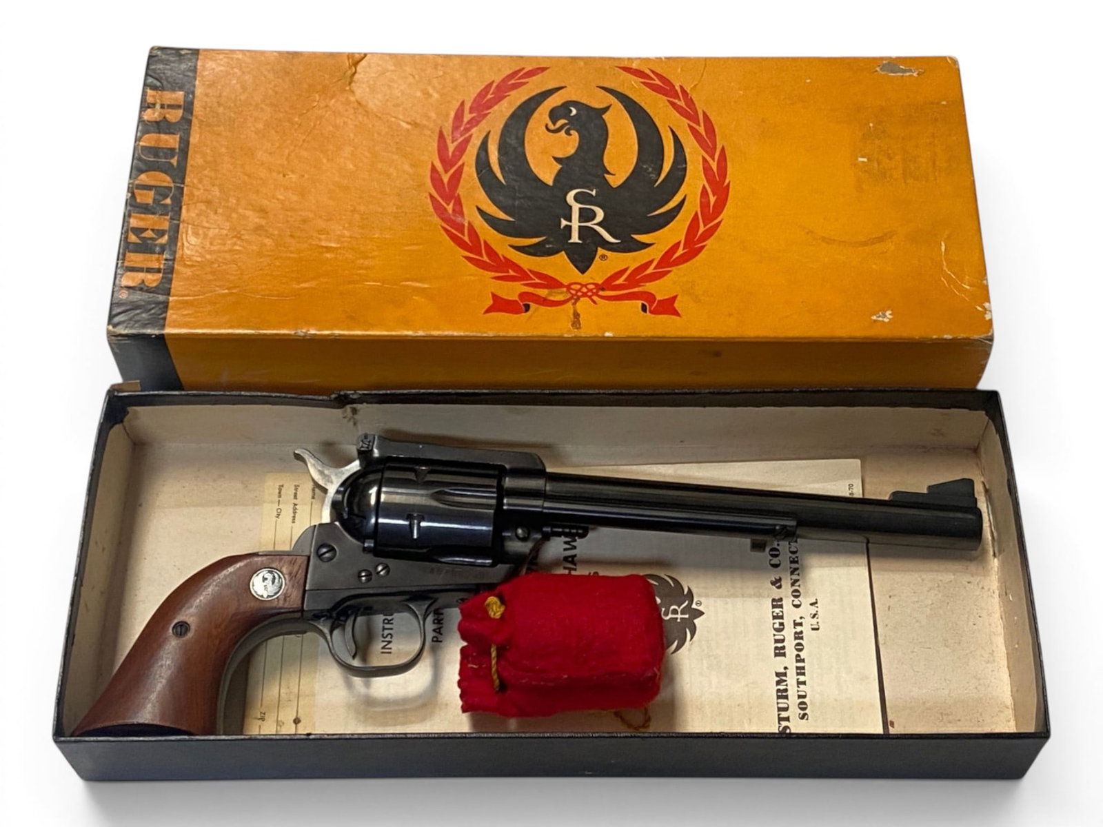 Excellent 1971 Ruger Blackhawk Convertible .45 LC/ACP 7.5" Revolver with Original Box & Cylinder: S#: 45-08050 | Mfg. 1971 | Catalog No. BKH45 | 7.5" Barrel | Comes in Original Box with Matching SN written on box, Extra Cylinder for .45 ACP, and Manual |||| CONDITION: Excellent, Like New. Shows si