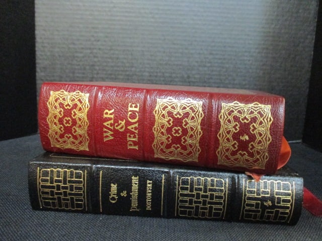 Two Eastman Press Leather Bound Classic Works of Literature: "War and Peace" by Leo Tolstoy and "Crime and Punishment" by Fyodor Dostoevsky. Books copyrights range from 1960-80's