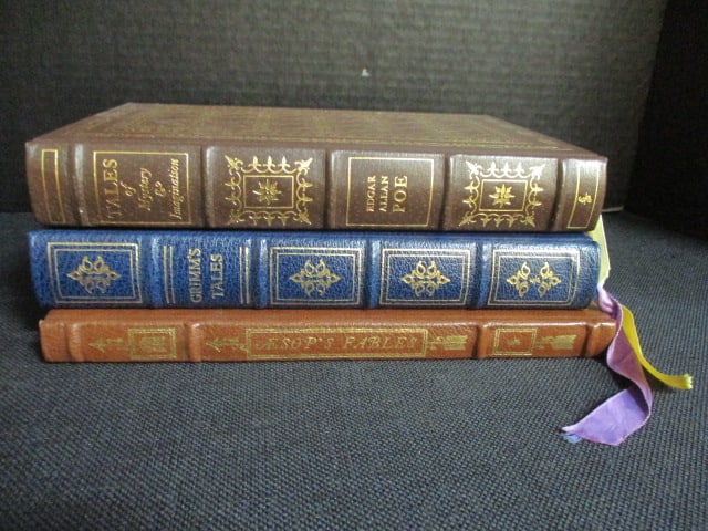 Three Eastman Press Leather Bound Classic Works of Literature: "Tales of Mystery & Imagination" by Edgar Allan Poe, "Grimm's Fairy Tales" and "Aesop's Fables". Books copyrights range from 1960-80's