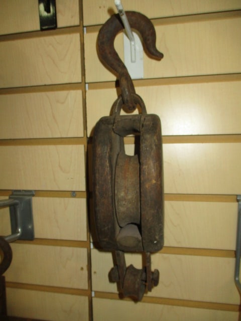 Antique Anvil Brand Wooden Pulley Block with Iron Hardware and Wheel: 13 1/2"h, has emblem with raised anvil maker's mark