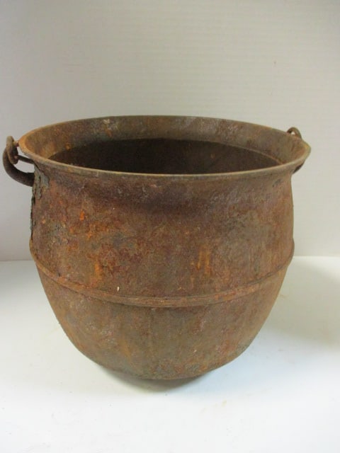 Vintage MB & Co. Cast Iron 4 Footed Cauldron with Coiled Wire Bail Handle: 10 1/4"dia x 9"h(15"h handle up), marked MB & Co. on bottom, rusted