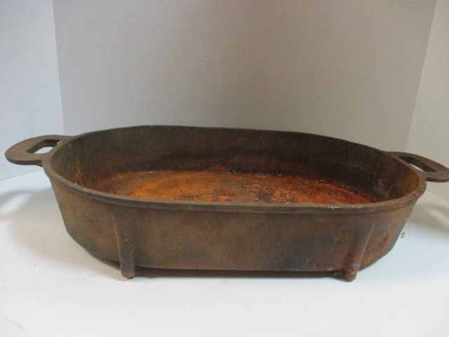Old Cast Iron Roasting Pan: 21" handle to handle x 11 1/2" x 3 1/2", marked C-S-7 on bottom, rusted, Local Pickup Only