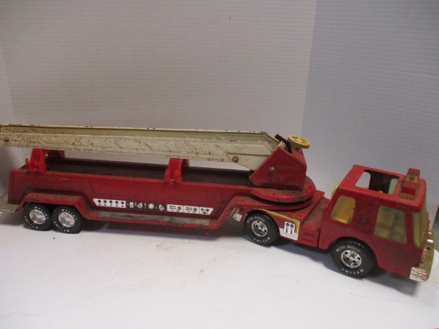 Old Nylint Metal Muscle Metal Toy Fire Dept. Ladder Truck: 31 1/2" long, well worn condition, rust spots and paint peeling see pictures and preview