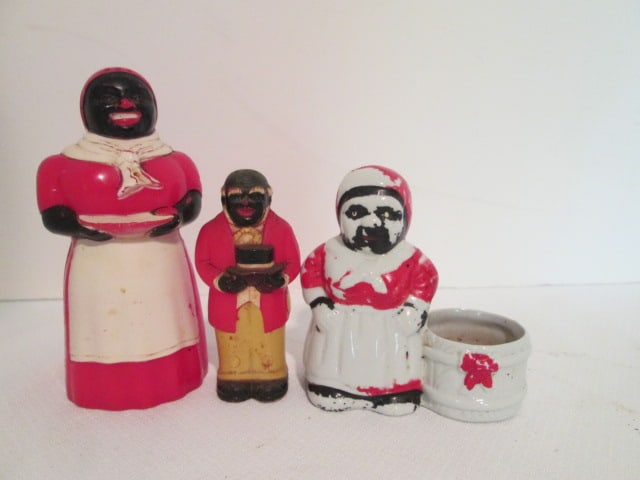 Vintage Black Americana F&F Mold & Die Works "Mammy" and "Amos" Shakers and: Handpainted Ceramic "Mammy" Votive Holder. Mammy shaker 5 1/4"h(small hole at seam), Amos 3 1/2"h, Votive holder 3 3/4"h(finish wear)