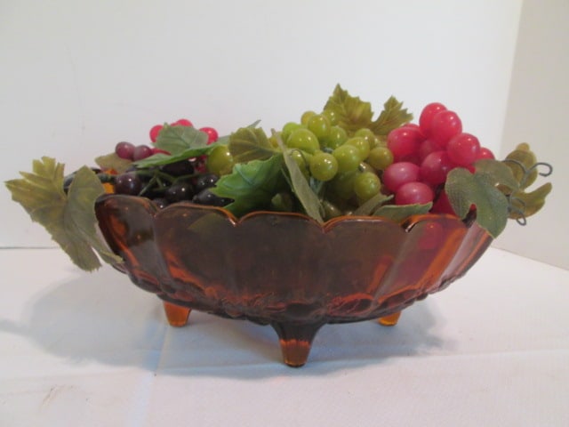 Midcentury Amber Glass Footed Fruit Bowl with Rubber Grape Clusters: bowl 12 1/2" x 8 3/4" x 4 1/2"