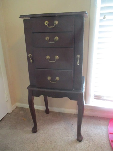 Queen Anne Style Mahogany Finish Jewelry Armoire: 17" x 13" x 37 1/2", hinged top with mirror, swing out side necklace storage and three drawers, legs need tightening, veneer chip on back, some scuffs and nicks, Local Pickup Only