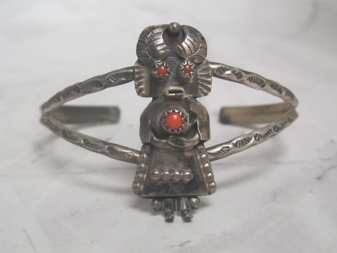 Sterling Silver Navajo Cuff Bracelet: Weighs 12.2 grams, Unmarked, Featuring a Kachina dancer with coral stone accents