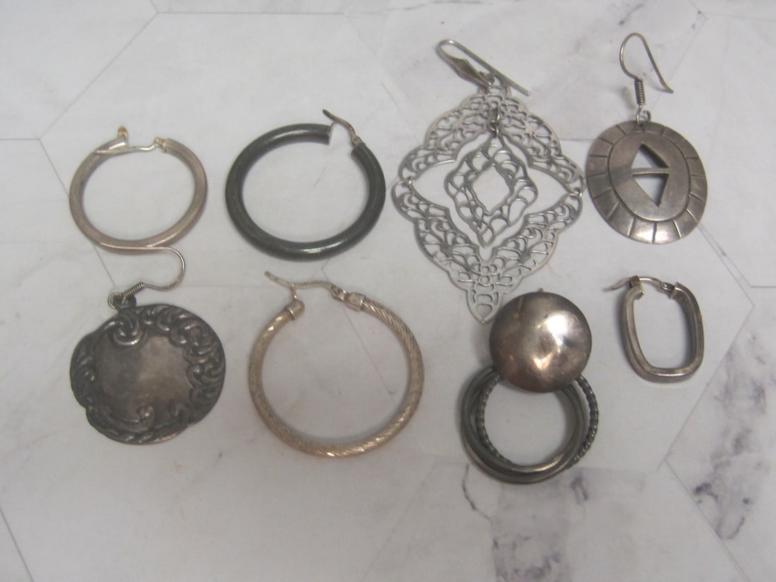 Lot of 8 Single Sterling Silver Earrings: Weighs 31.6 grams