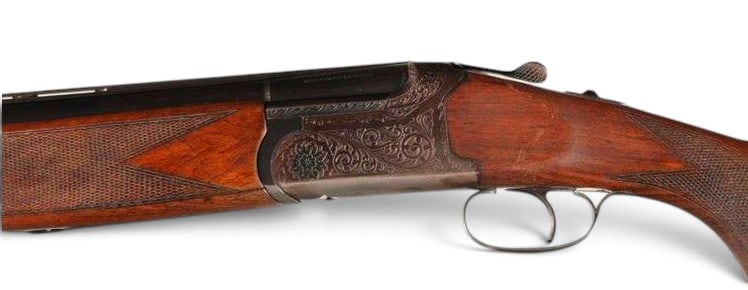 Engraved Animo Express 12 GA. O/U Double Barrel Hammerless Shotgun: S#: 112237 | 27.5" Vent-Rib Barrel with single bead front sight | 2-3/4" Chamber | Fixed Chokes measuring Imp. Modified and Full | 14-1/2" Length of Pull | Checkered pistol grip wood stock | Single