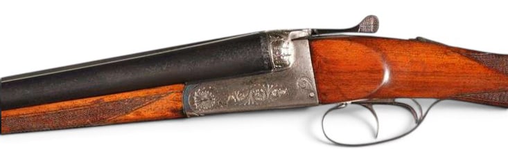 Engraved Spanish 12 GA. SXS Double Barrel Hammerless Shotgun: S#: 1743 | 27.75" Solid Rib Barrel with Front bead sight | 2-3/4" Chamber |14-1/2" Length of Pull | Full and Improved Modified Choked Barrels | Checkered Walnut Straight Grip Stock | Double Triggers