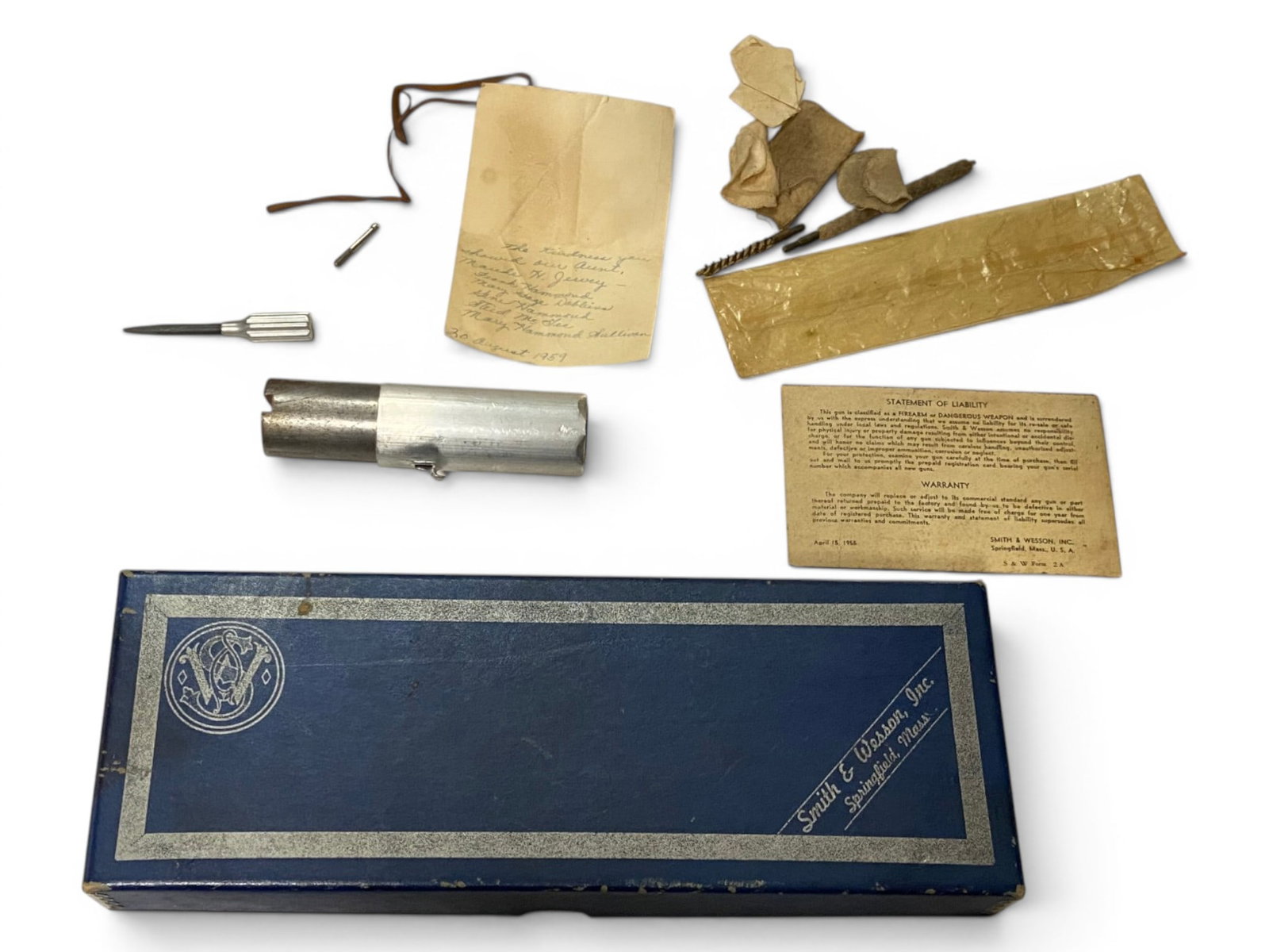 Vintage Smith & Wesson K-22 Masterpiece 2-Piece Factory Revolver Box w/ Various Tools: Box in good condition for age. For K-22 Masterpiece with 6 Inch Barrel and Blue Finish. Comes with warranty paper, a handwritten 1959 dated note, sight screwdriver adjustment tool, grip screw, cleanin
