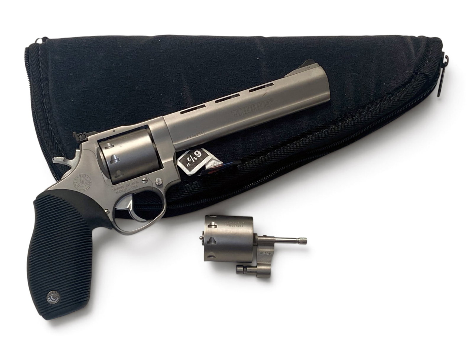 Excellent Taurus Tracker .22LR-22MAG Revolver: S#: FW669541 | 6.5" Barrel | 9 Shot SA/DA Revolver | Comes with a 9 Shot .22Mag Cylinder, and Soft Case. |||| CONDITION: Excellent. Retaining 99% Original Brushed Stainless Finish. Mechanically