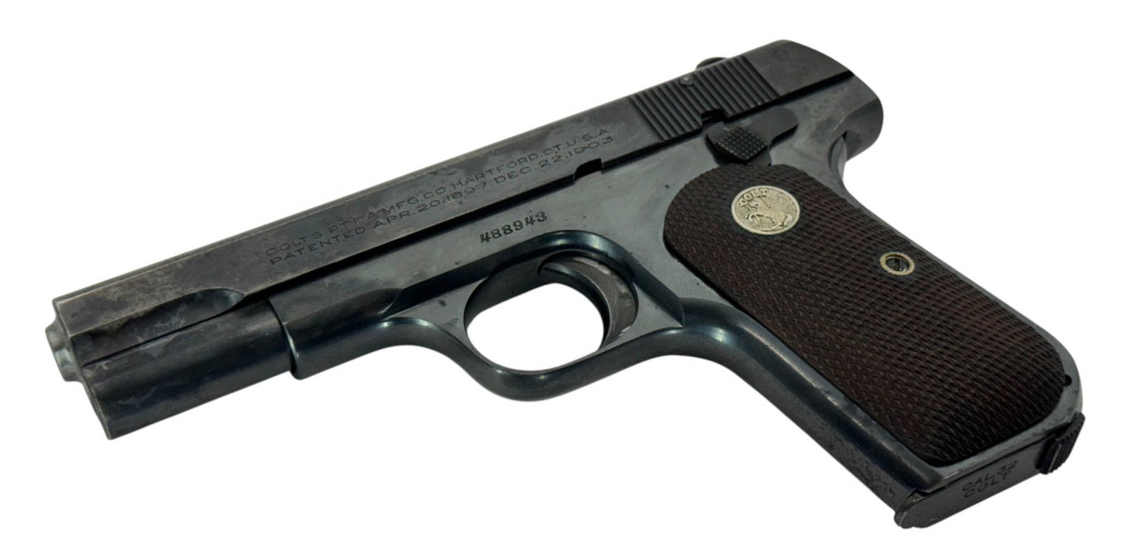 1928 Colt M1903 Hammerless .32 ACP Semi-Automatic Pistol: S#: 488943 | Type IV Variant Mfg. 1928 | Original Gloss Blue Finish and Wood checkered silver medallion grips | Comes with (1) Excellent MINT Two-tone magazine stamped “CAL .32/COLT” on ba