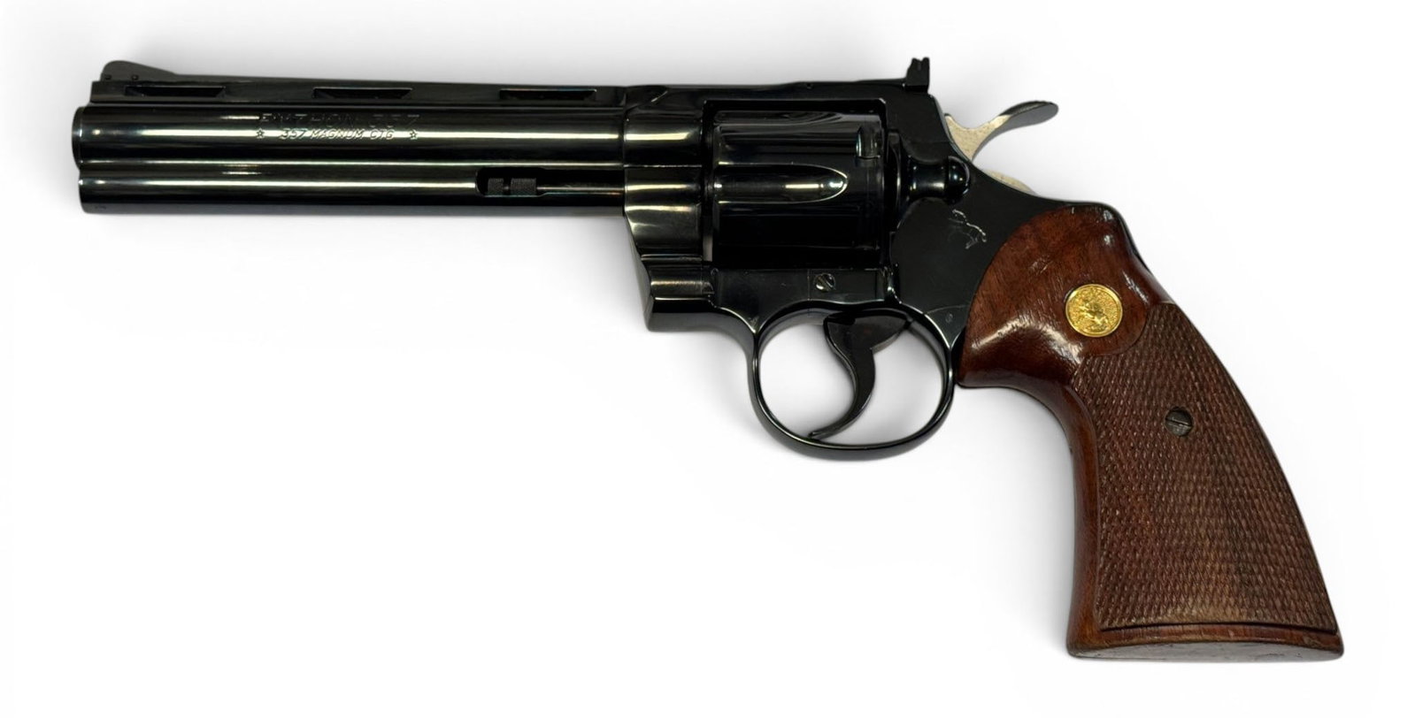 Excellent 1975 Colt Python 6" Blued .357 MAGNUM Revolver: S#: 14651E | Mfg. 1975 | 6" Barrel | Factory Blue finish |||| CONDITION: Excellent. 100% original finish. Wood grips are very good with some wear and handling marks and a few dings on bottom. Mechanic