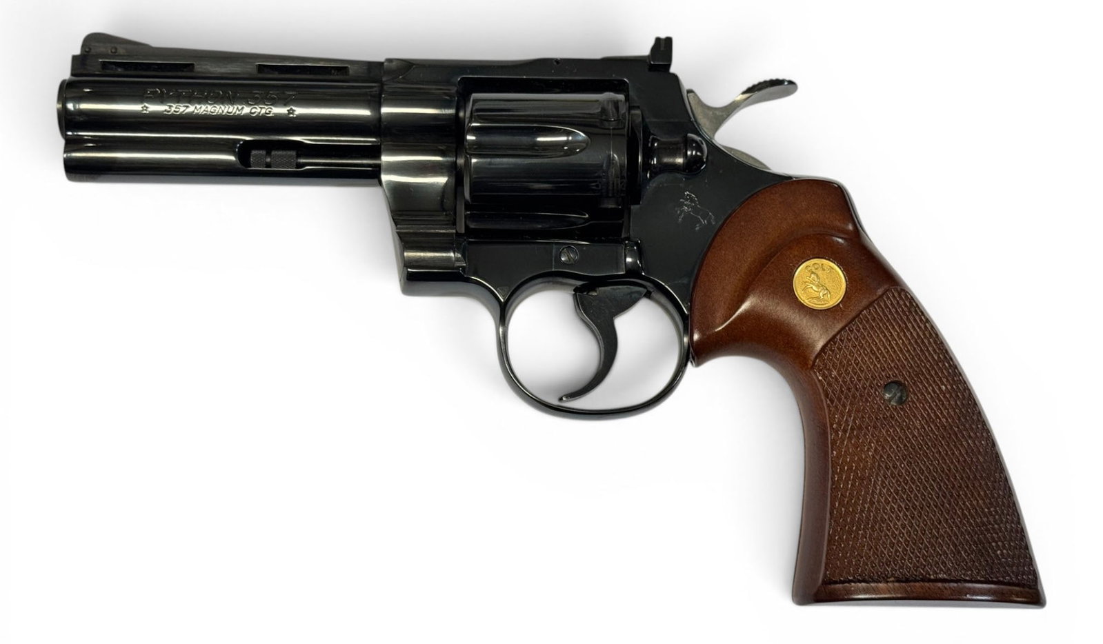Excellent 1978 Colt Python 4" Blued .357 MAGNUM Revolver: S#: V17188 | Mfg. 1978 | 4" Barrel | Factory Blue finish |||| CONDITION: Excellent, like new. 100% original finish. Mechanically functions. Bore is excellent. Wood grips are excellent ||||| CLASS: MOD