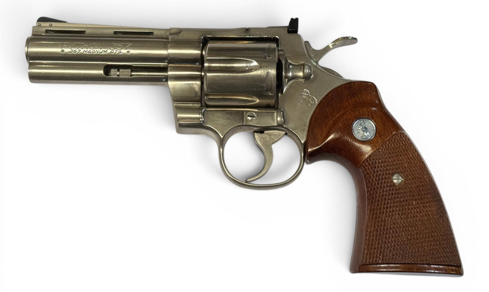 Excellent 1979 Colt Python 4" Bright Nickel .357 MAGNUM Revolver: S#: V55528 | Mfg. 1979 | 4" Barrel | Factory Bright Nickel Finish |||| CONDITION: Excellent. 100% original finish with minor storage oxidation. Should clean up well. Mechanically functions. Bore is