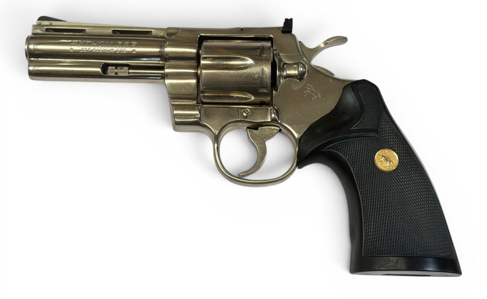 Excellent 1980 Colt Python 4" Nickel .357 MAGNUM Revolver: S#: V93345 | Mfg. 1980 | 4" Barrel | Factory Nickel finish | Black rubber medallion presentation Pachmayr grips |||| CONDITION: Excellent. 100% original finish with some minor storage oxidation.