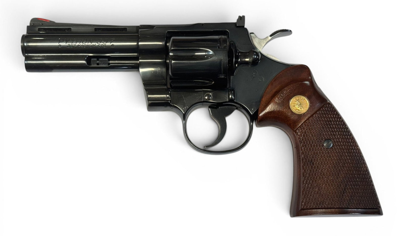 Excellent 1987 Colt Python 4" Blued .357 MAGNUM Revolver: S#: T61847 | Mfg. 1987 | 4" Barrel | Factory Blue finish |||| CONDITION: Excellent. 100% original finish. The slightest bit of storage wear on right side of barrel and some oxidation on the hammer.