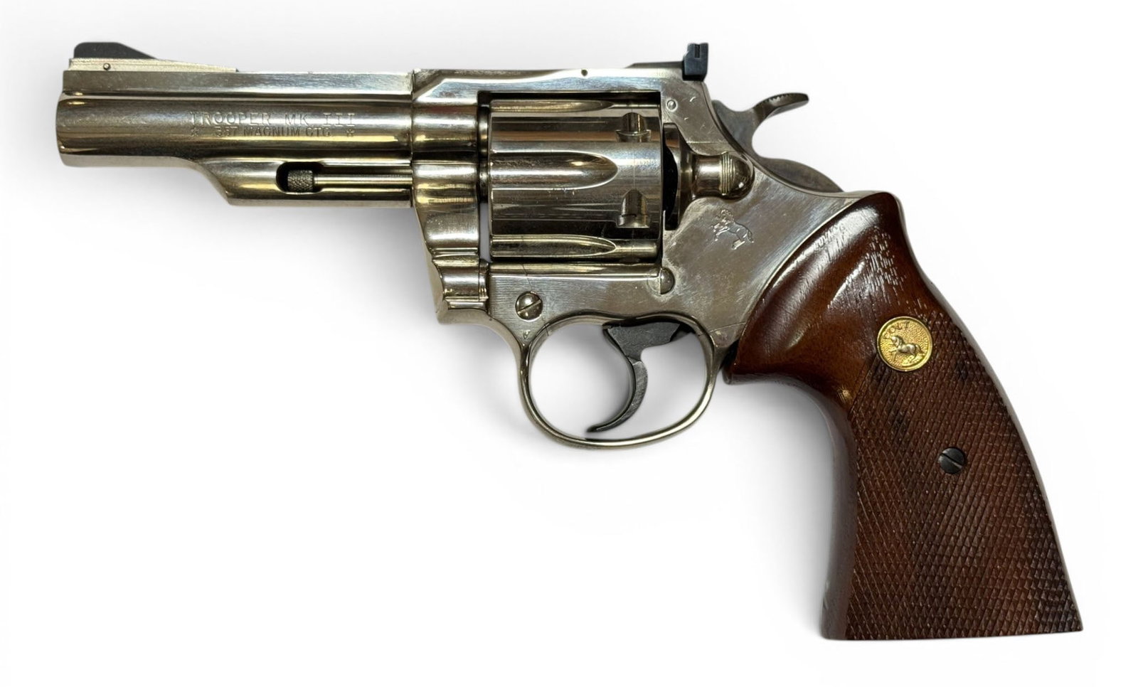 Excellent 1978 Colt Trooper MK. III 4" Nickel .357 MAGNUM Revolver: S#: L91841 | Mfg. 1978 | 4" Barrel | Factory Nickel finish |||| CONDITION: Excellent. 99% original nickel finish with some surface rust spotting on bottom of trigger guard. Slight oxidation on surface