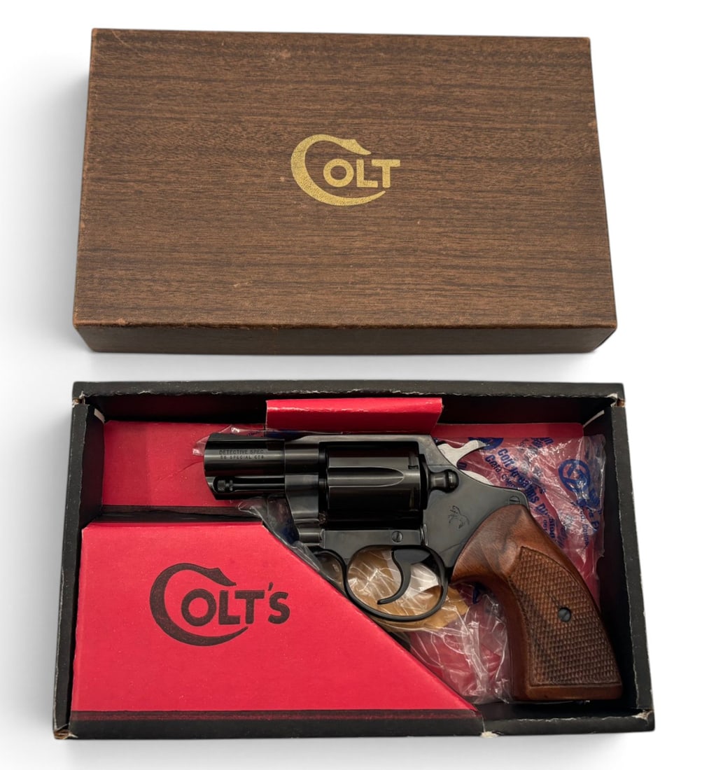 NIB 1972 Colt Detective Special .38 SPL Snub Nose Revolver with Original Box: S#: C02966, Comes in Factory Wood Grain Box with Matching Label | 2" Snub Nose Barrel | 6 Shot SA/DA Revolver |||| CONDITION: New in Box. Equipped with Wide Wood Checkered Grips. Mechanically Function