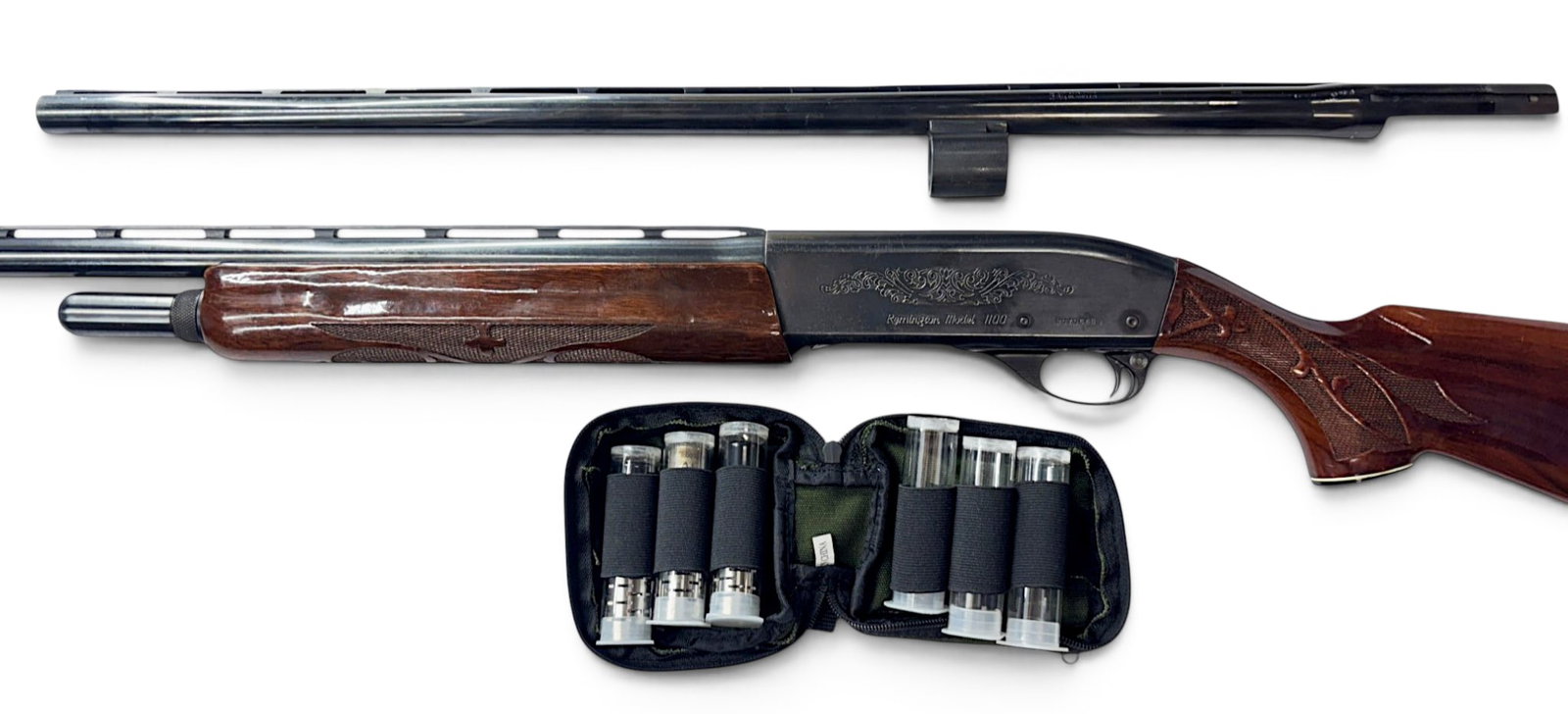 1989 Remington Model 1100 Deluxe 12 GA. Semi-Automatic Shotgun 2-Barrel Set in Case w/ Chokes: S#: P070648V | Mfg. 1989 | Standard / Deluxe Model 1100 with nice scroll engraved design on receiver and crisp wood checkering | Comes with the original 28” Factory Vent-Rib MOD Choke Barrel (2-