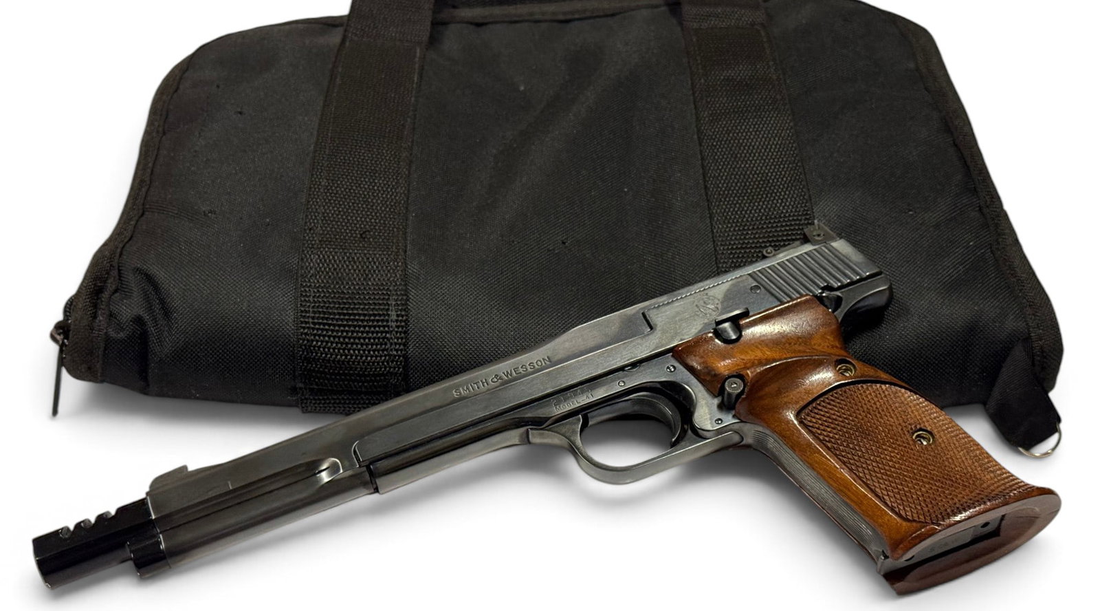 MINT Collector's 1959 Smith & Wesson Model 41 .22 LR Semi-Auto 7-3/8” Target Pistol w/ Muzzle : S#: 21945 | Mfg. 1959 | 7-3/8” Barrel with Aluminum Muzzle Brake | Has a Loaded Chamber & Cocking Indicator on Rear | Low Serial number | Equipped with original 2-piece walnut wood checkered