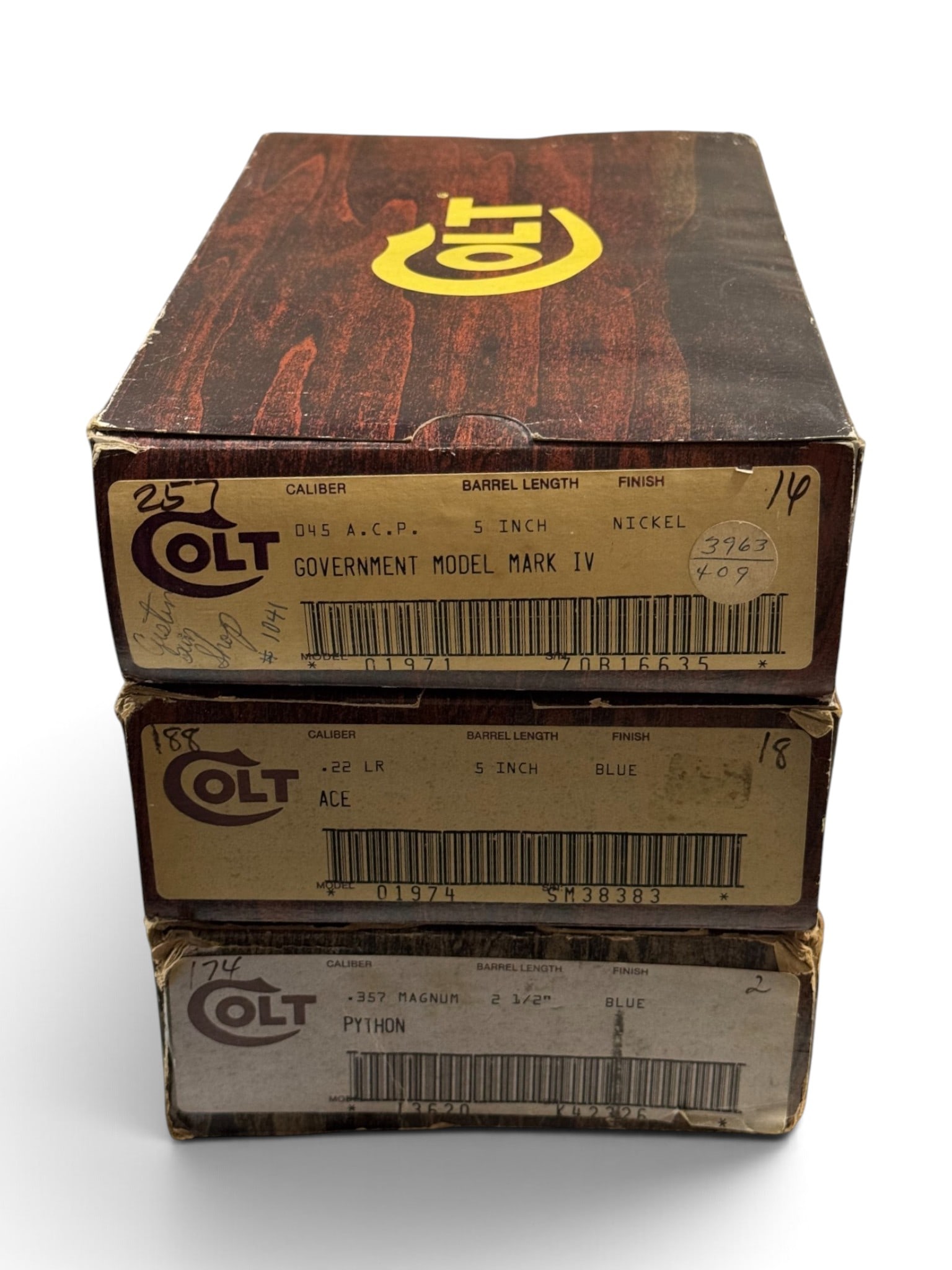 (3) Factory Colt Wood Grain Boxes with Inserts & Paper Labels - Mark IV, ACE, and Python: (1) Colt Government Model Mark IV Model 01971 .45 ACP, 5" BBL, Nickel Finish Box with Insert and all the paperwork like new | (2) Colt ACE Model 01974 .22 LR, 5" BBL, Blue Finish Box with Styrofoam in