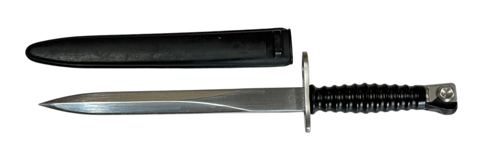 Swiss Military SIG M57 Bayonet with Scabbard by Victorinox: Knife bayonet for use on the renowned 7.5 mm Sturmgewehr 57 (STGW-57) made by SIG. Blade measures approximately. 9.5” and overall length measures 14.5”.