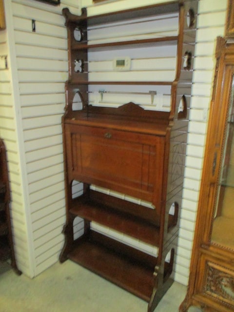 Antique Gothic Revival Secretary Bookcase with Fall Front Writing Desk: One piece cabinet, Three uppers shelves and two lower shelves, Fall front has lock and key with two Knapp construction drawers and slot organizers, Right upper side has split, some nicks and scuffs,