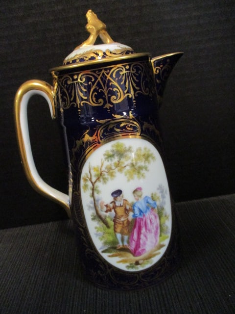 Antique Japanese Moriage Porcelain Tea and Coffee Set with Heavy Gilt Decorations: Set includes 9 3/4"h coffee pot, 4"h teapot with strainer insert, 3"h creamer, 2 3/4"h sugar bowl(does not have lid) and pair of 3/4"h cups with saucers